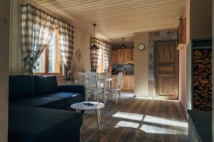 a living room with a couch and a table at Peipsi Homestay in Kuru