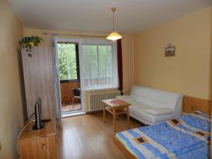 A bed or beds in a room at Apartmán Zdravie Horný Smokovec