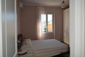 Posteľ alebo postele v izbe v ubytovaní ilGirasole b&b