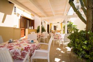 a patio with a table and chairs and a table and chairsktop at B&B Ghiaccio in Gallipoli