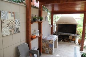 a patio with an outdoor oven in a house at Apartments Time Off in Zaboric
