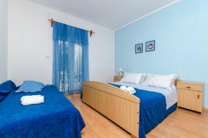 Postel nebo postele na pokoji v ubytování Apartments Helena