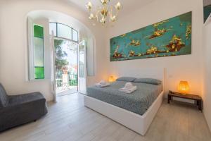 Una cama o camas en una habitación de Villino Emanuele