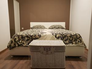 a bedroom with a bed with a table in front of it at Bed and breakfast Nika in Rab
