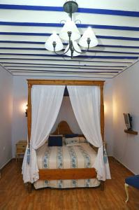 Postel nebo postele na pokoji v ubytování Casa Rural la Quinteria de Sancho piscina para tres apartamentos + 14 fotografií