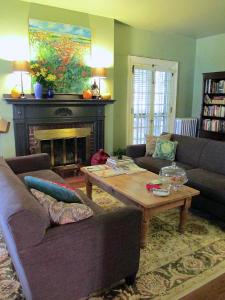 a living room with a couch and a coffee table at The Lancaster Bed and Breakfast in Lancaster