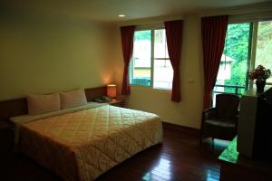 מיטה או מיטות בחדר ב-Li Tang