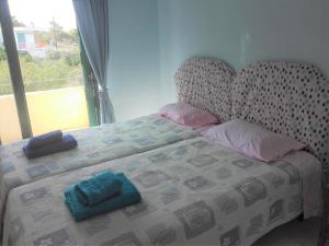 Postel nebo postele na pokoji v ubytování Pasha Bay Residence