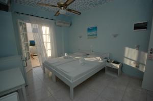 Een bed of bedden in een kamer bij Pension Ocean View