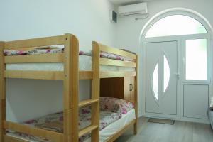 Postel nebo postele na pokoji v ubytování Apartments Oki