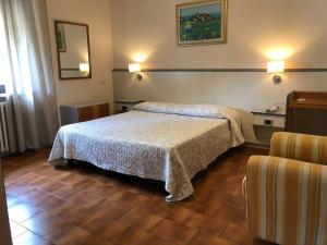 Postel nebo postele na pokoji v ubytování Hotel Ai Tufi