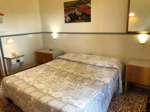Postel nebo postele na pokoji v ubytování Hotel Ai Tufi