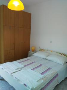 Posteľ alebo postele v izbe v ubytovaní Falopa Apartments