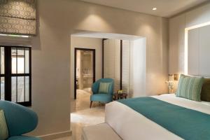 Voodi või voodid majutusasutuse Souq Al Wakra Hotel Qatar By Tivoli toas