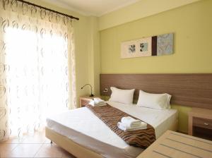 Ένα ή περισσότερα κρεβάτια σε δωμάτιο στο Eleonas Apartments