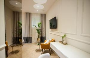 TV a/nebo společenská místnost v ubytování Club 5 boutique rooms
