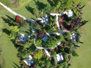 an overhead view of a mansion with trees and houses at Relais Sassa al Sole in San Miniato