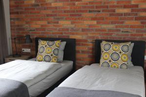 Łóżko lub łóżka w pokoju w obiekcie Apartamenty Centrum Park Sowińskiego 19