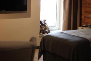 Łóżko lub łóżka w pokoju w obiekcie Apartamenty Centrum Park Sowińskiego 19