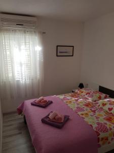 Postel nebo postele na pokoji v ubytování Apartments Centar - Mirjana