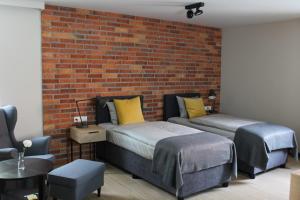 Łóżko lub łóżka w pokoju w obiekcie Apartamenty Centrum Park Sowińskiego 19
