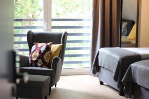 Łóżko lub łóżka w pokoju w obiekcie Apartamenty Centrum Park Sowińskiego 19