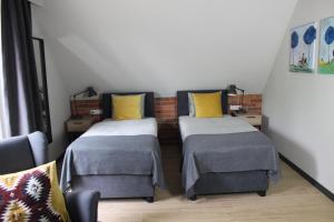 Łóżko lub łóżka w pokoju w obiekcie Apartamenty Centrum Park Sowińskiego 19