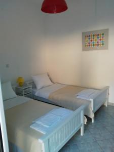 Posteľ alebo postele v izbe v ubytovaní Falopa Apartments