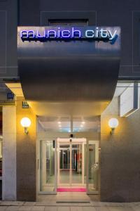 a building with a sign on the front of it at Hotel Munich City in Munich