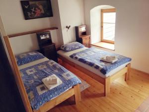 Postel nebo postele na pokoji v ubytování Guest House Turistična kmetija Plaznik
