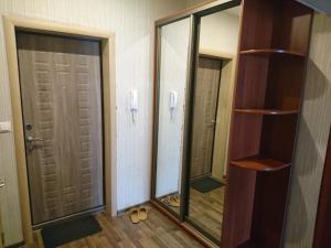 a room with two large mirrors and a closet at Kommunisticheskaya 15-62 in Saransk