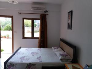 Un ou plusieurs lits dans un hébergement de l'établissement Ksamil Apartments