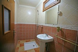 a bathroom with a sink and a mirror at Riad Taghazoute in Marrakesh