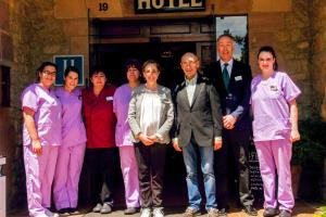 a group of people standing in front of a hotel at Hotel Los Angeles in Santillana del Mar