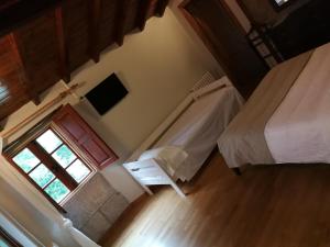 En eller flere senge i et værelse på Iberik Casa Vilamor