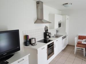 Kuchyňa alebo kuchynka v ubytovaní Apartment Voorhorst + 25 fotografií