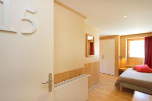 Postel nebo postele na pokoji v ubytování Hotel le Sherpa