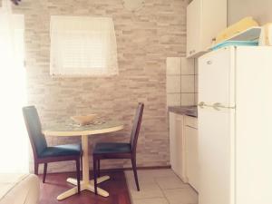 Kuchyň nebo kuchyňský kout v ubytování Apartmani Babić Vir