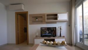Telewizja i/lub zestaw kina domowego w obiekcie As Apartamentos Turisticos