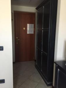 a room with a door and a door to a hallway at Hotel Terra Di Gallura in Budoni