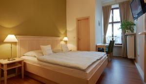 Кровать или кровати в номере Pension Martinerhof