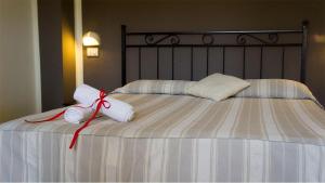 Postel nebo postele na pokoji v ubytování Hotel Borgo Antico