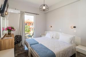 Posteľ alebo postele v izbe v ubytovaní Rooms 48 by Zante Plaza