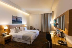 Ένα ή περισσότερα κρεβάτια σε δωμάτιο στο Citea Apart Hotel