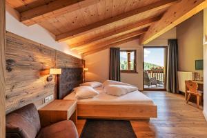 Кровать или кровати в номере Mountain Lodge Prennanger