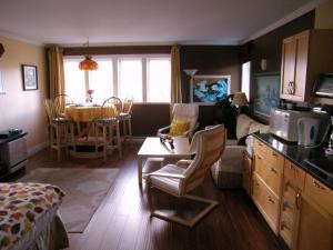 a room with a kitchen and a living room at Above the Inlet in Sechelt