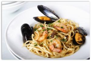 a plate of pasta with shrimp and mussels at Casa Giavada in Sciacca