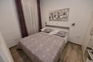 Postel nebo postele na pokoji v ubytování Apartment Cecilija