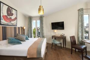 Postel nebo postele na pokoji v ubytování Régence Etoile