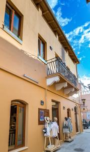 a building with clothes on display outside of it at Sofita Hotel in Preveza